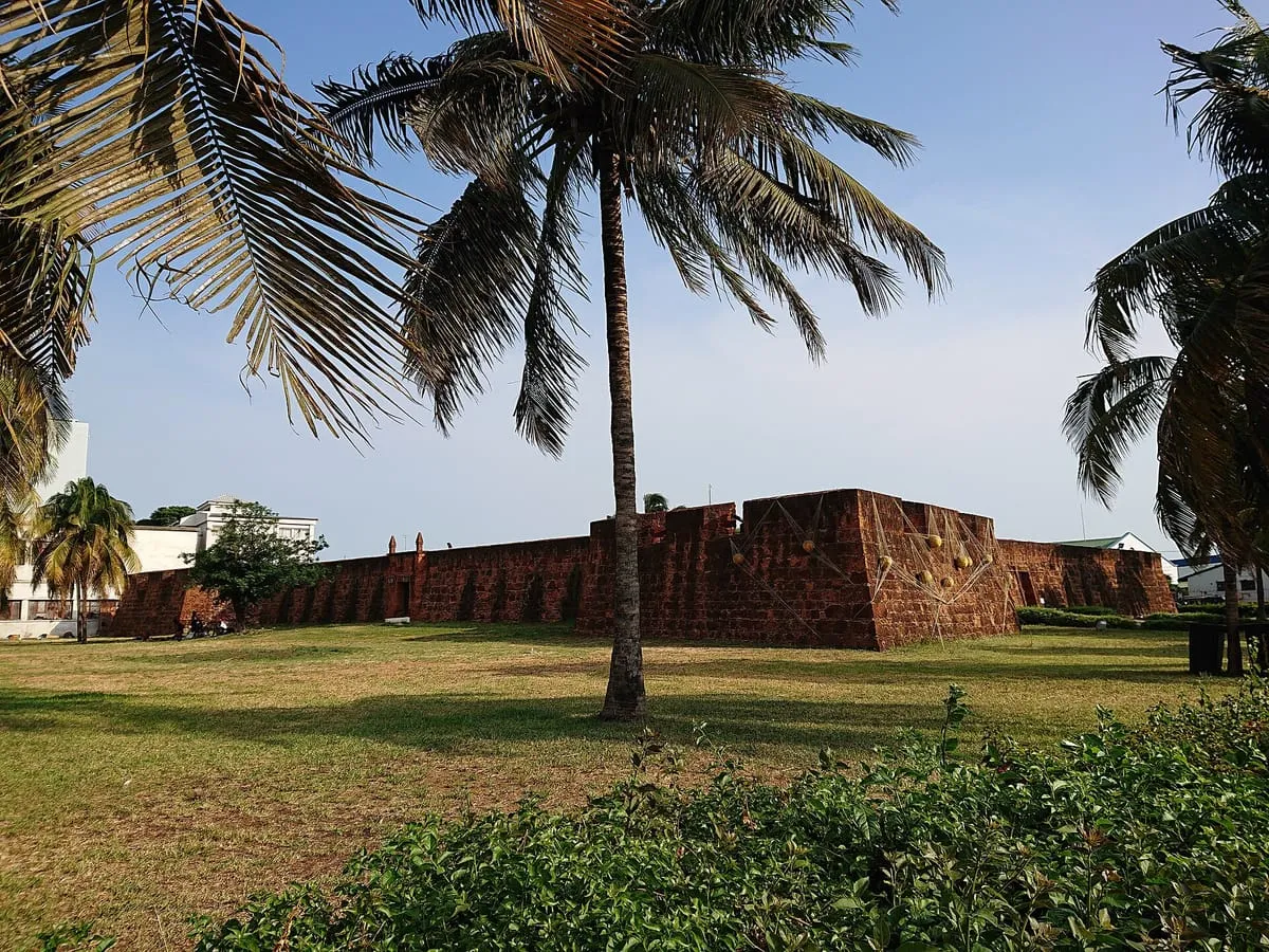 Walls of the Fortress of Our Lady of the Conception in Maputo, among palm trees