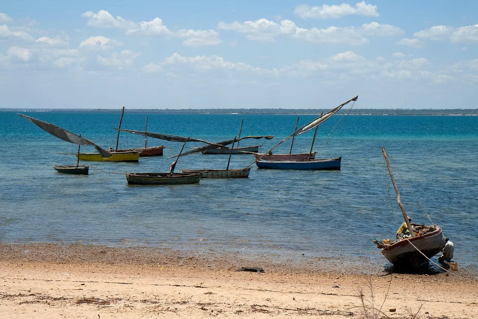 Dhows anchored in the turquoise water off the Island of Mozambique