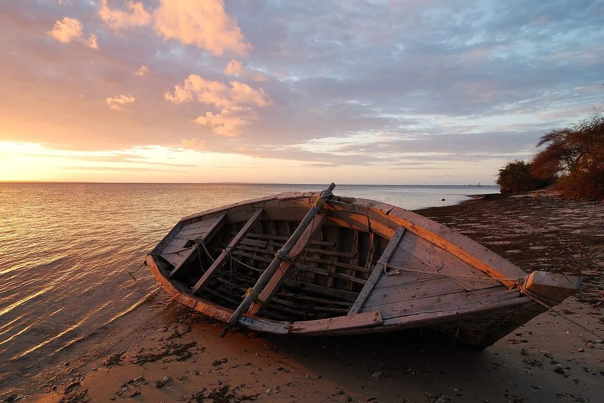 Fishing boat on the beach of Ibo Island, Quirimbas Archipelago, at sunset